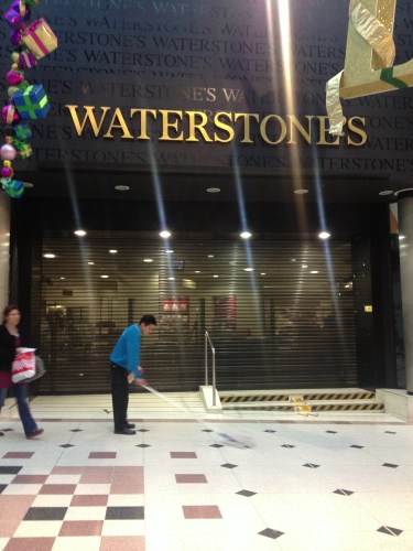 Made sadder by Christmas decorations and lone cleaner.